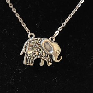 ADORABLE BABY ELEPHANT IN STERLING SILVER WITH AMBER STONES.